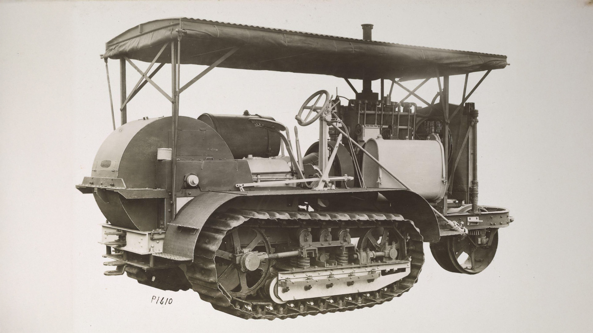 Excellent side-rear view of a Peoria Military Holt 75, note the protective shrouding over the steering clutches, drive assembly, and main clutch. Fluteless starting flywheel is also visible.