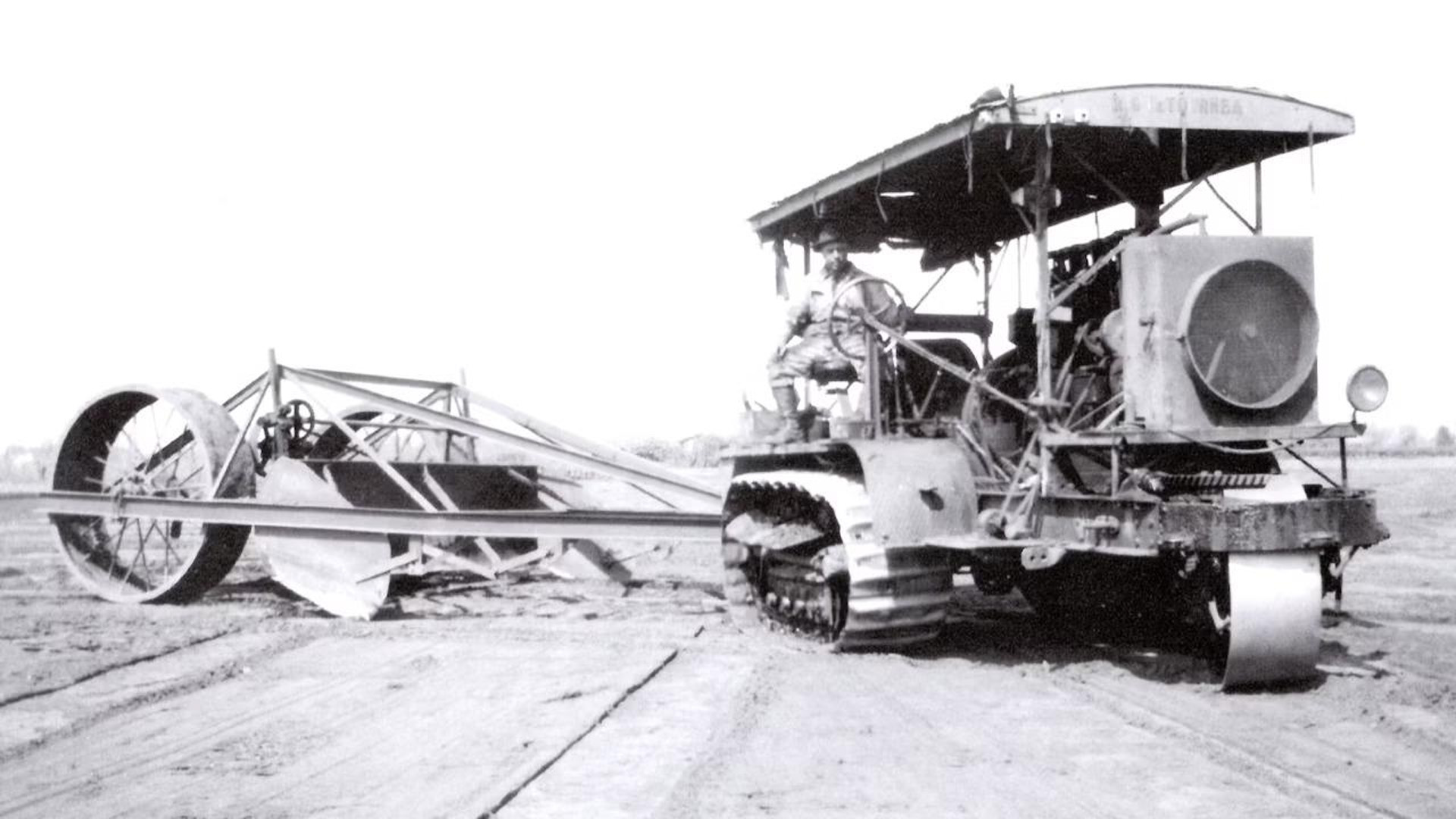 R.G. LeTourneau in the seat of his Stockton Holt 75 pulling his first one man operated “Full-Drag” scraper, 1921.